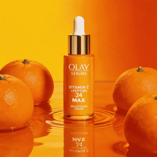 Olay Vitamin C Peptide Glow Serum bottle with brightening citrus design on white background