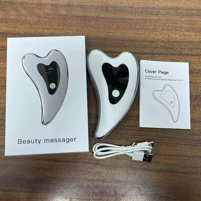 Electric Gua Sha massager in hand for facial skincare and massage with ergonomic design and USB rechargeability